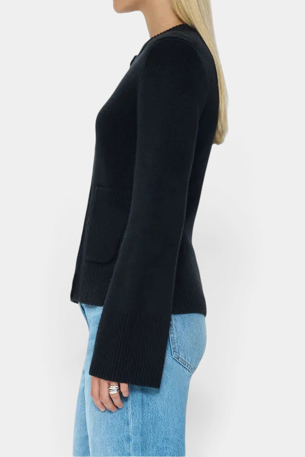 The Copper Shed Dani cardigan in noir black featuring a button-front, cinched waist, and soft premium knit fabric.