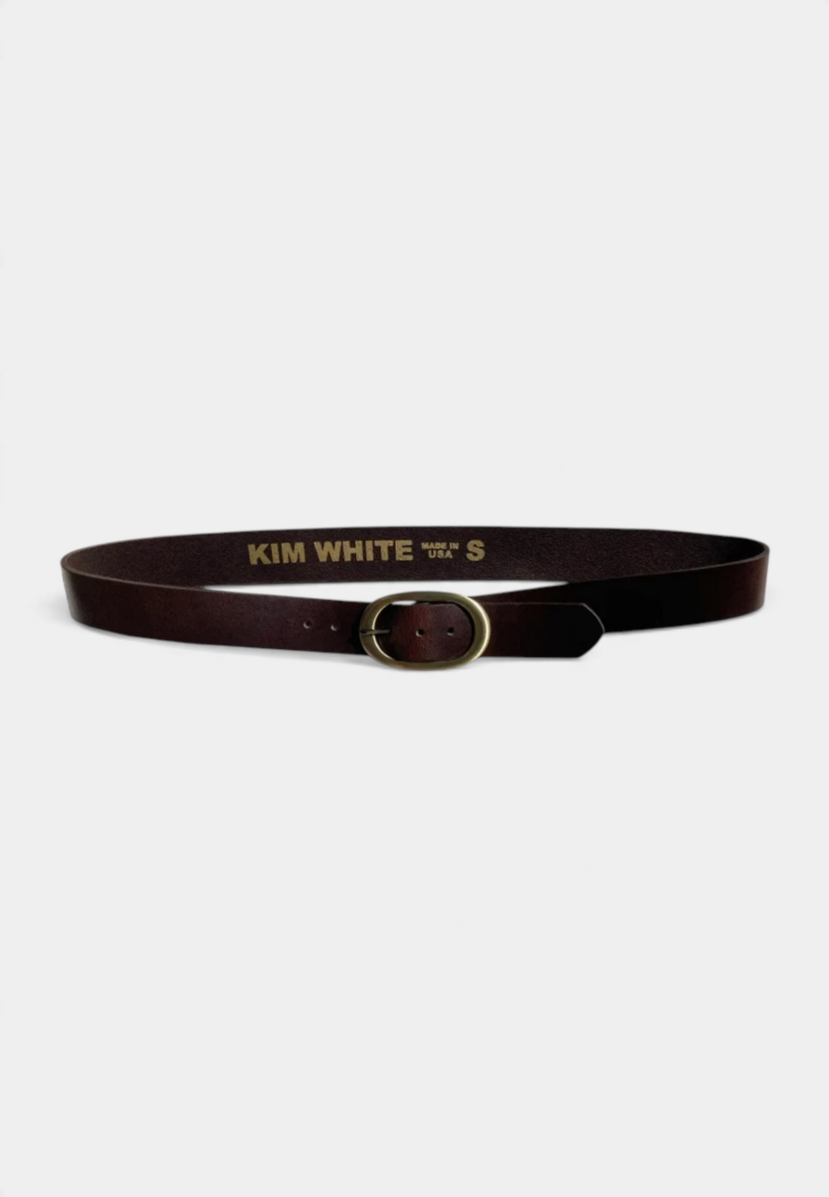 The Copper Shed dark brown leather belt with an antique brass elongated oval buckle