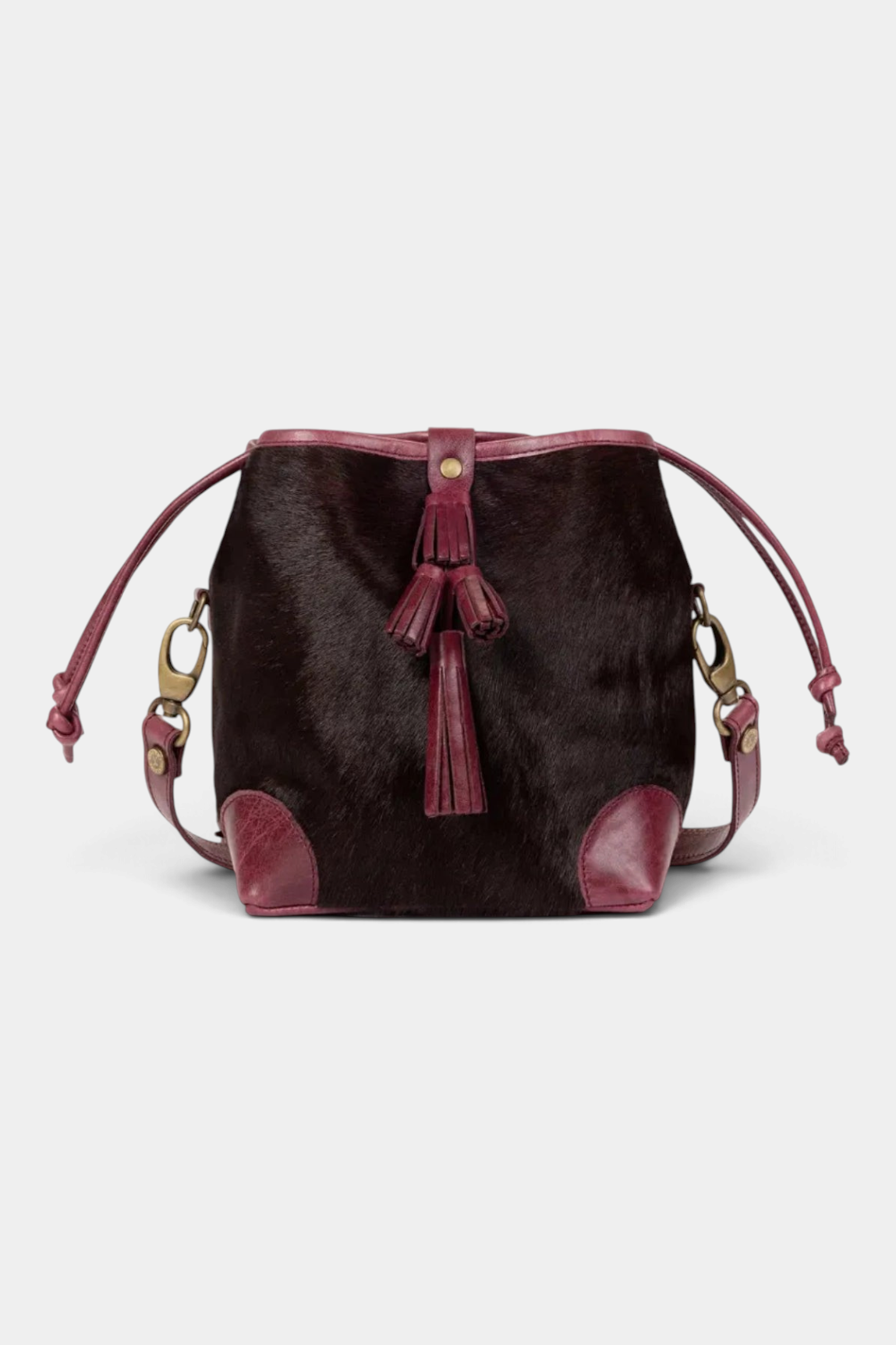 The Copper Shed dark cherry long-haired pony cowhide Fortune Teller bag with leather trim and tiered tassel detail.