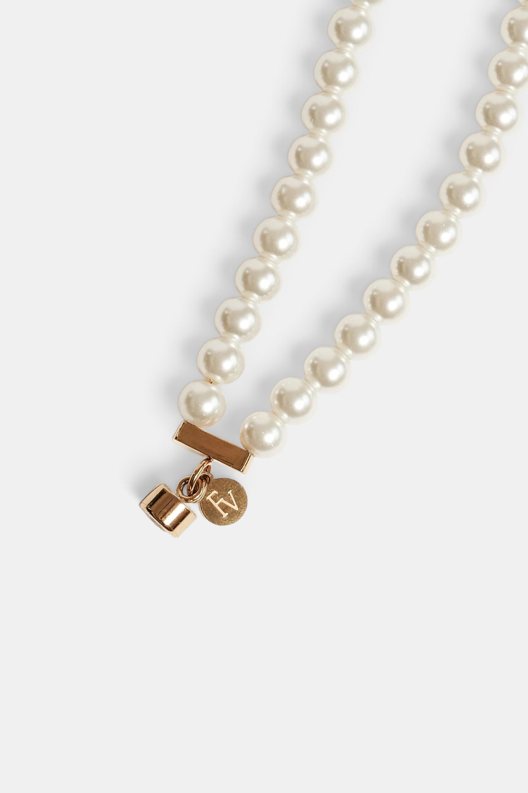 The Copper Shed double strand pearl necklace with gold plated stainless steel magnetic closure and logo charm