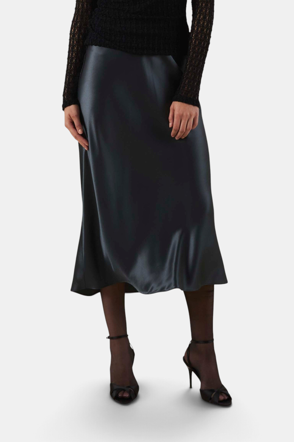 The Copper Shed Ella skirt in black satin with a flattering bias-cut silhouette and high-rise waist.