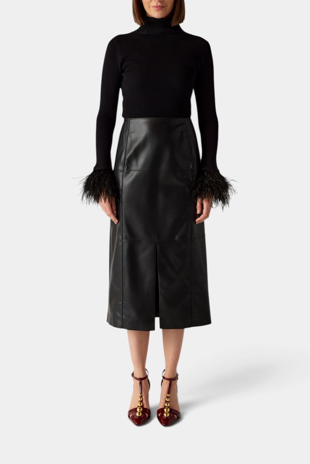 The Copper Shed Elliott midi pencil skirt in black vegan leather with pick stitching and a front slit