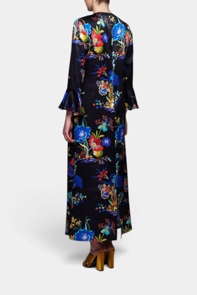 The Copper Shed long silk dress in black with vibrant floral print, featuring 3/4 ruffled sleeves and back zip.