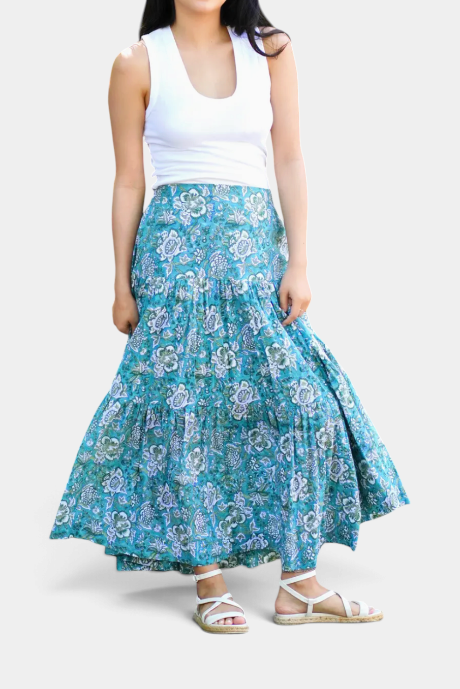 The Copper Shed ankle length tiered cotton skirt featuring a blue and green floral block print pattern on a model.