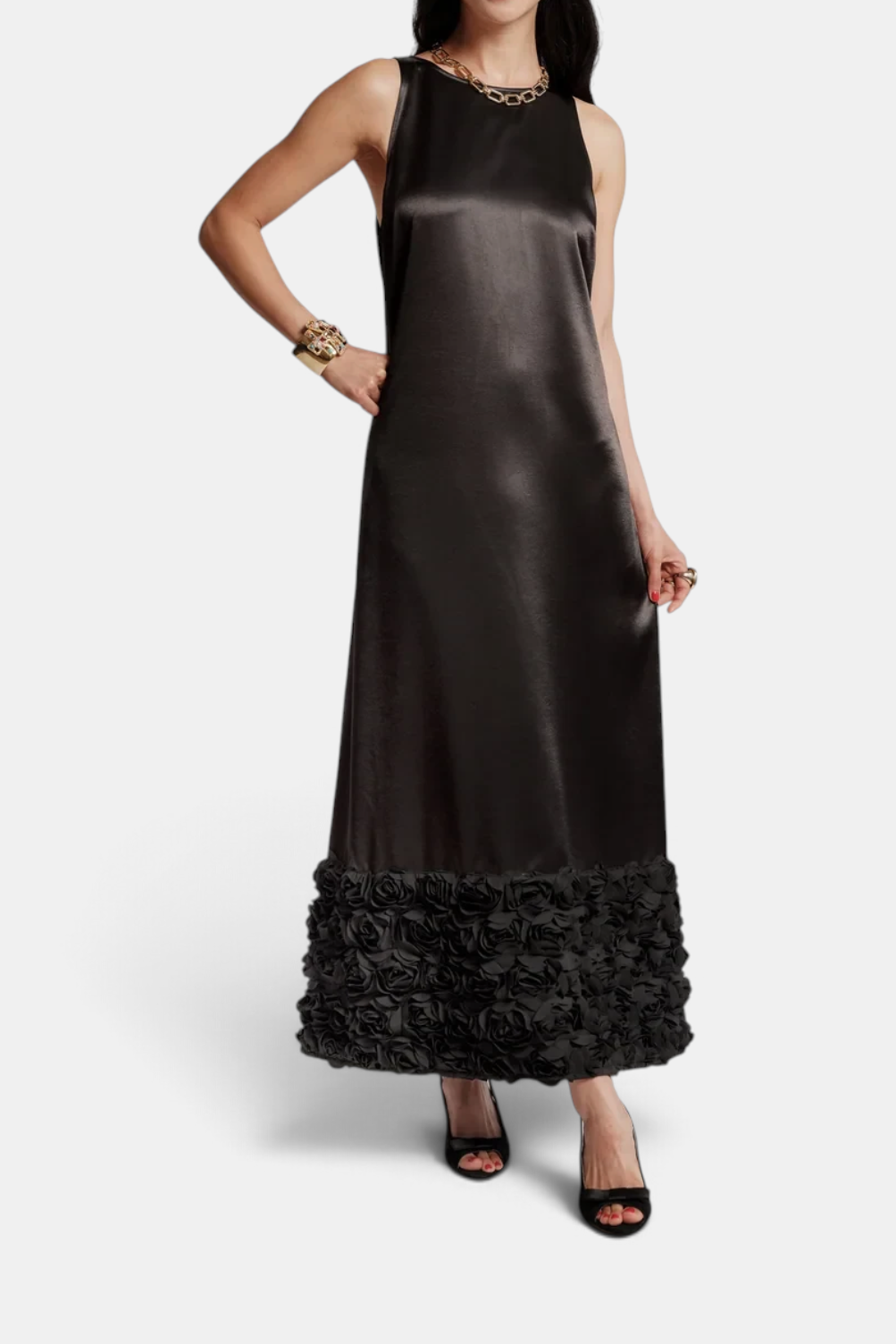 The Copper Shed Francesca black maxi dress in poly Dutch satin featuring a floral applique hem and sleeveless cut.
