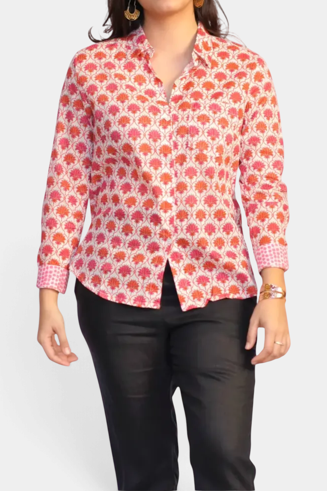 The Copper Shed Frannie long sleeve cotton shirt with a red and pink floral hand block print and contrasting cuffs.