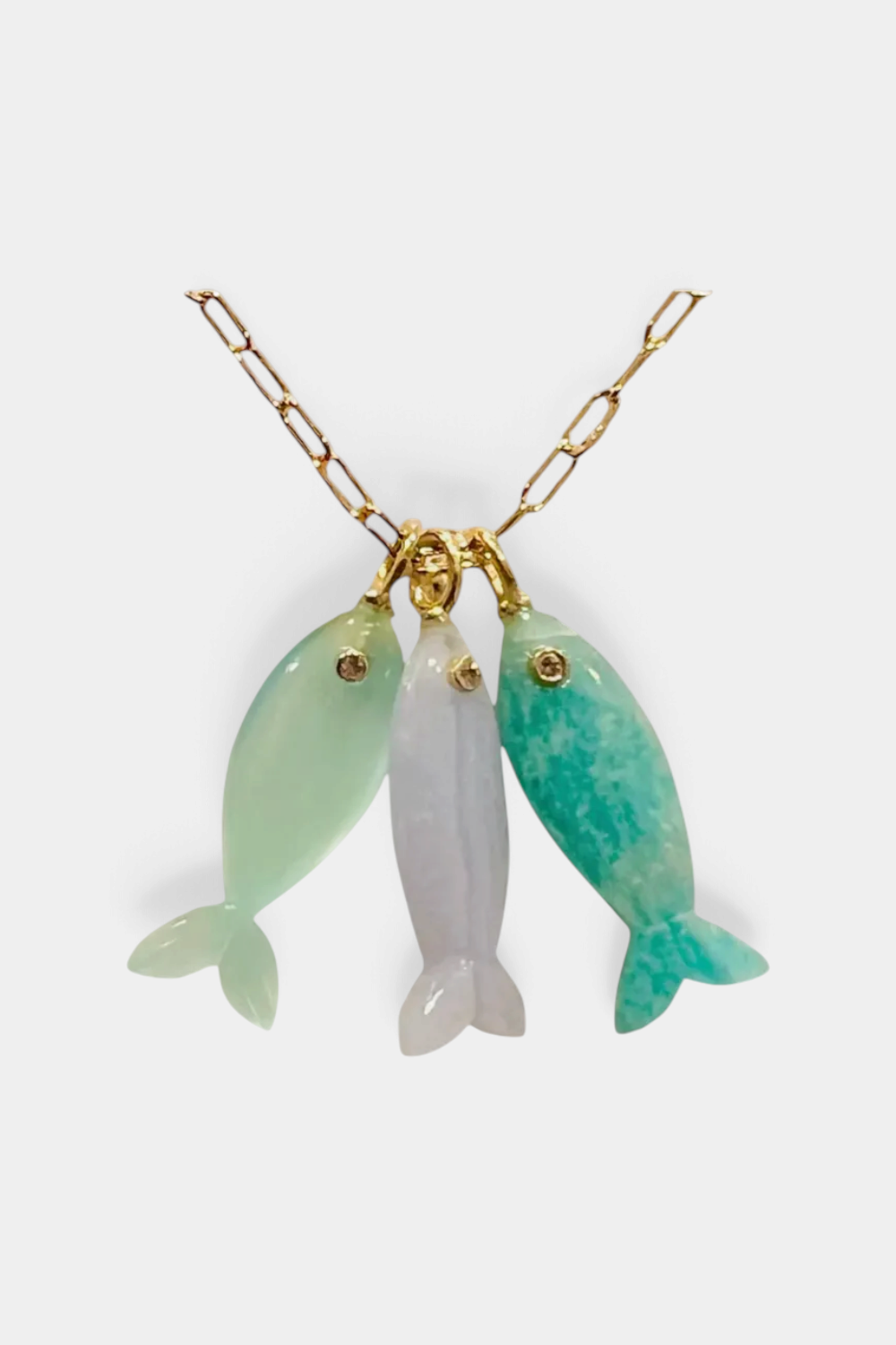 The Copper Shed Fresh Catch necklace featuring three gemstone fish pendants on a 14k gold fill paperclip chain.