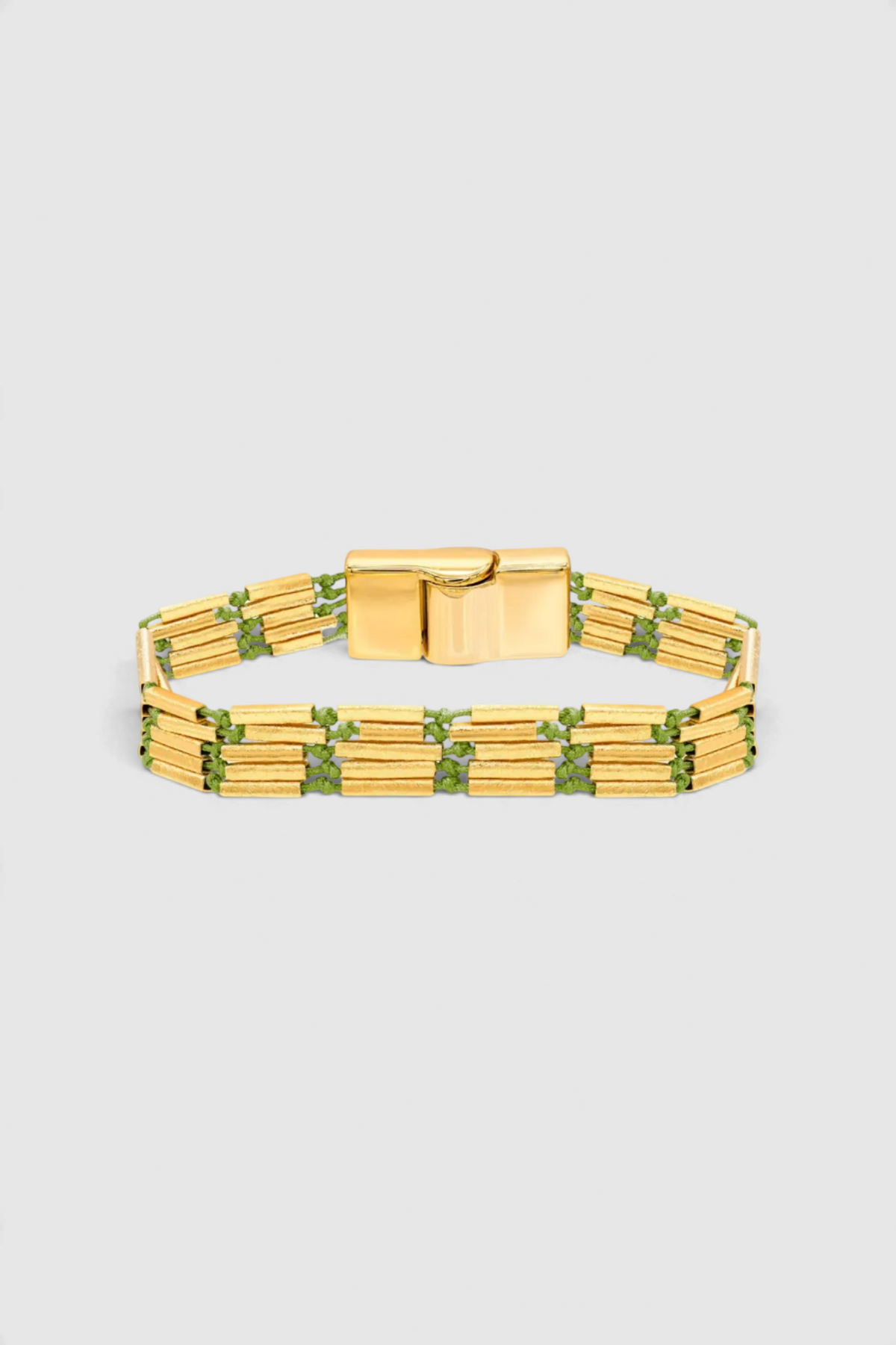 The Copper Shed Seraphine multi-strand bracelet with 18k gold plated cylinder beads and green string magnetic closure.
