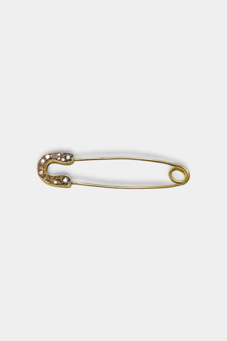 The Copper Shed 1.5-inch gold safety pin featuring a row of sparkling diamonds for a decorative accessory.