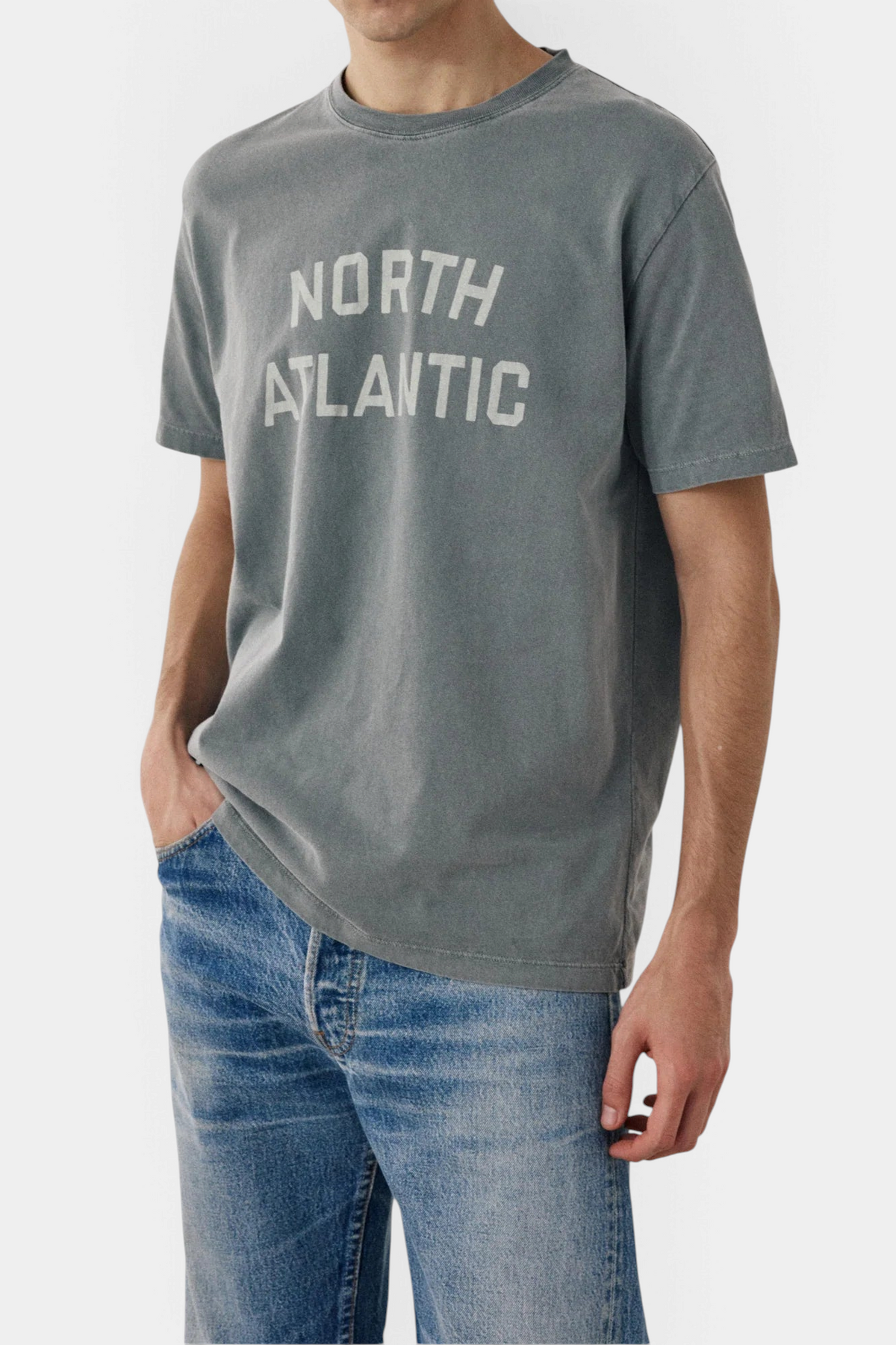 The Copper Shed North Atlantic green cotton jersey t-shirt with chest pocket and boxy fit on a male model