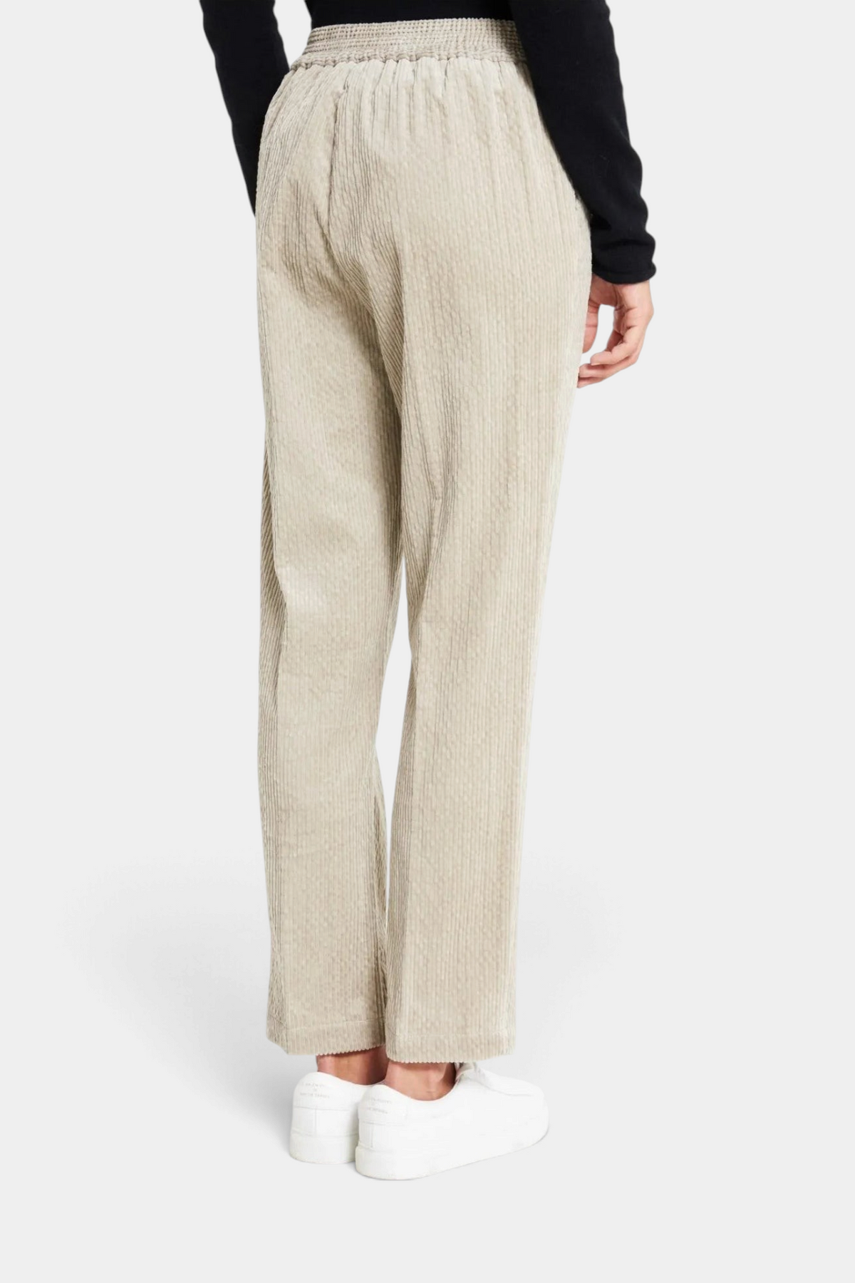 The Copper Shed Haiti cigarette pants in beige stretch corduroy with an elasticated back waist and turn-up cuffs.