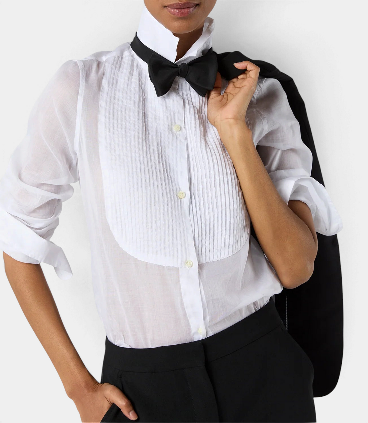 The Copper Shed Hattie shirt in white sheer Italian cotton organdy with a pleated bib front and black bow tie.