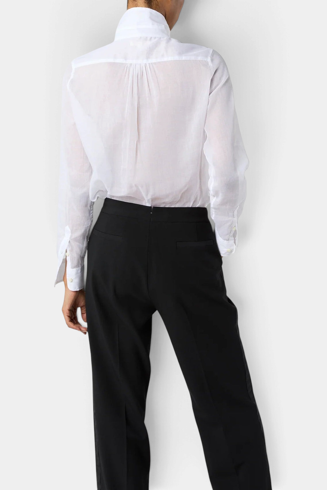 The Copper Shed Hattie shirt in white sheer Italian cotton organdy, back view showing pleated detail and cuffs.
