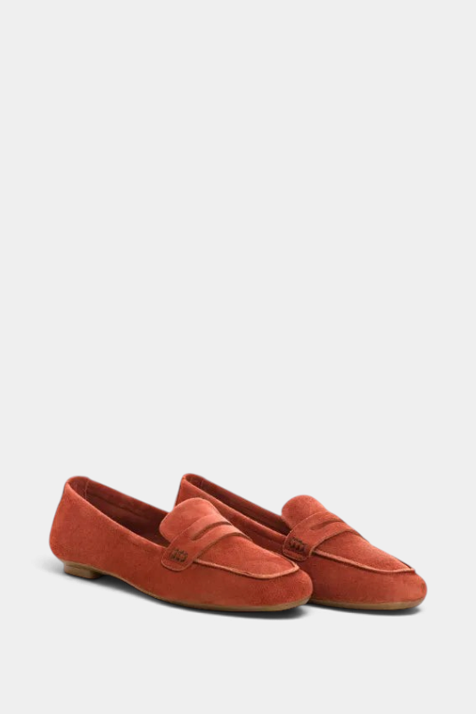 The Copper Shed Hema suede moccasin loafers in rust orange with a low 1cm heel and classic penny strap detail.