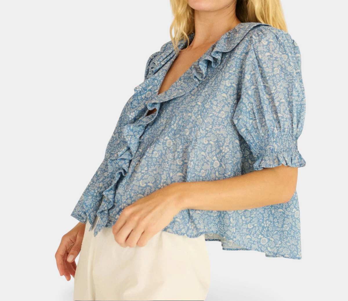 The Copper Shed Henri Top in blue floral organic cotton voile with ruffled V-neck and puffed sleeves