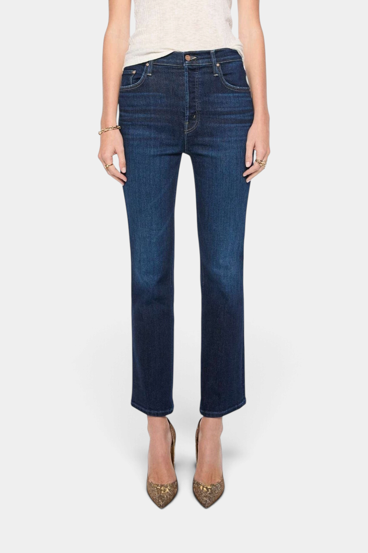 The Copper Shed high-rise dark blue flare jeans with seamed details and a clean hem worn by a model