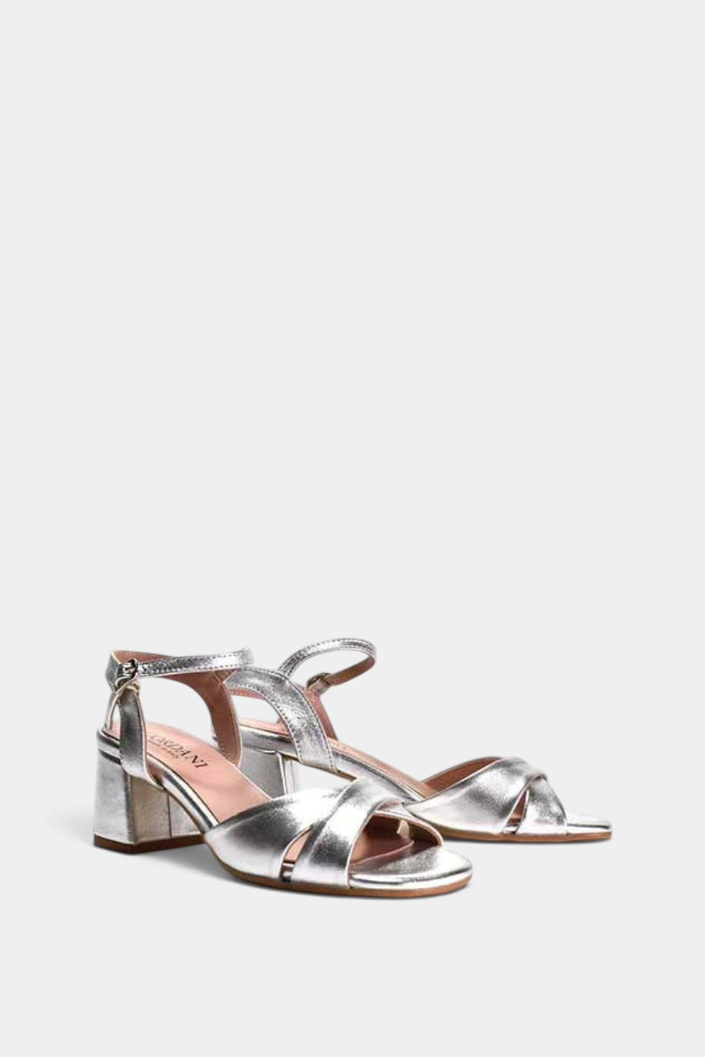 The Copper Shed Ilaria silver metallic leather heeled sandals with criss-cross straps and a block heel.