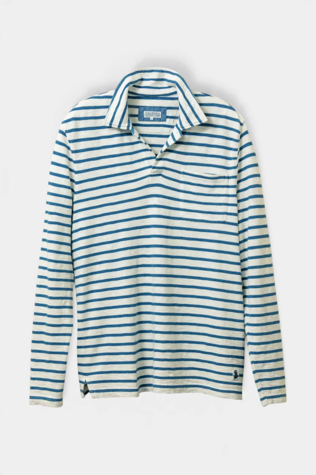 The Copper Shed long sleeve polo shirt in white with overdyed indigo stripes, featuring a one-button collar and pocket