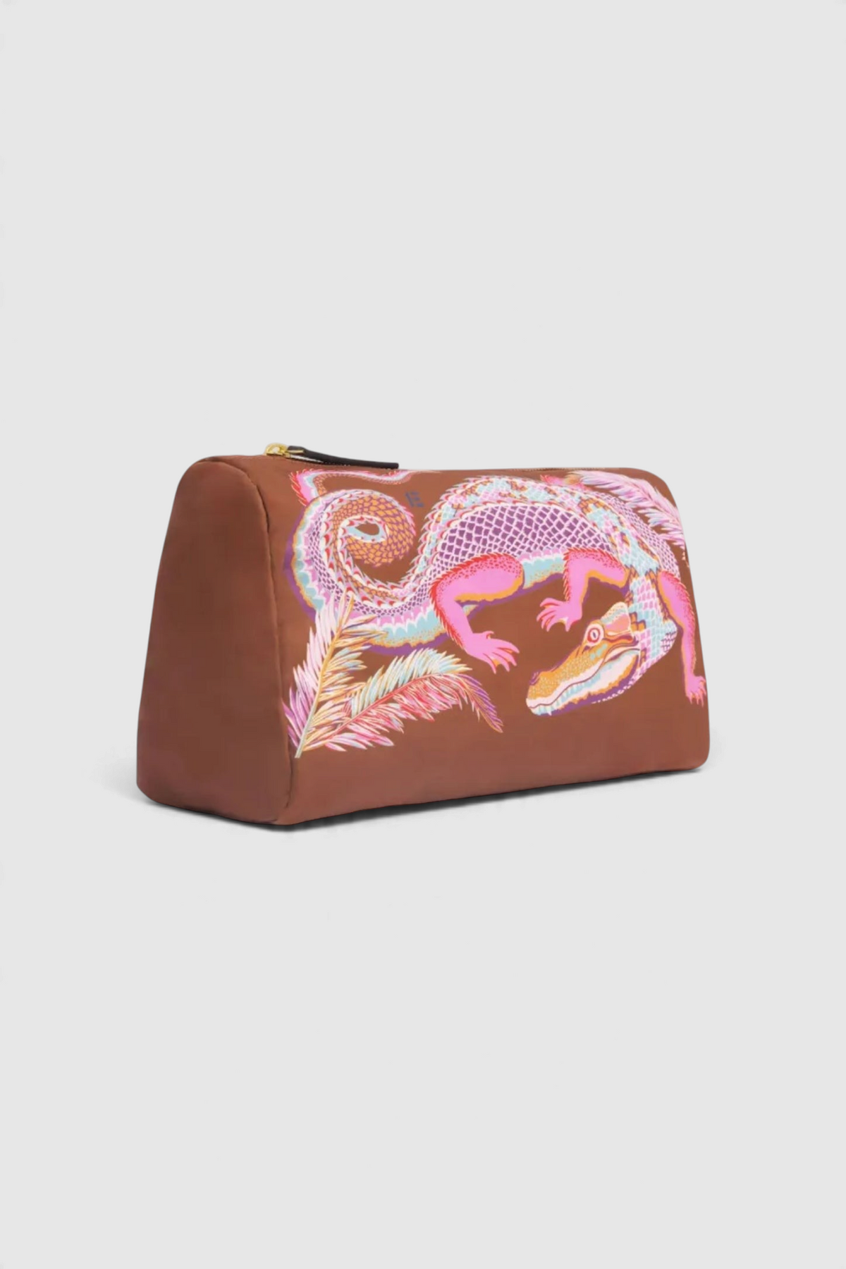 The Copper Shed Inoui Case in brown recycled polyester with a colorful crocodile print and leather trim.