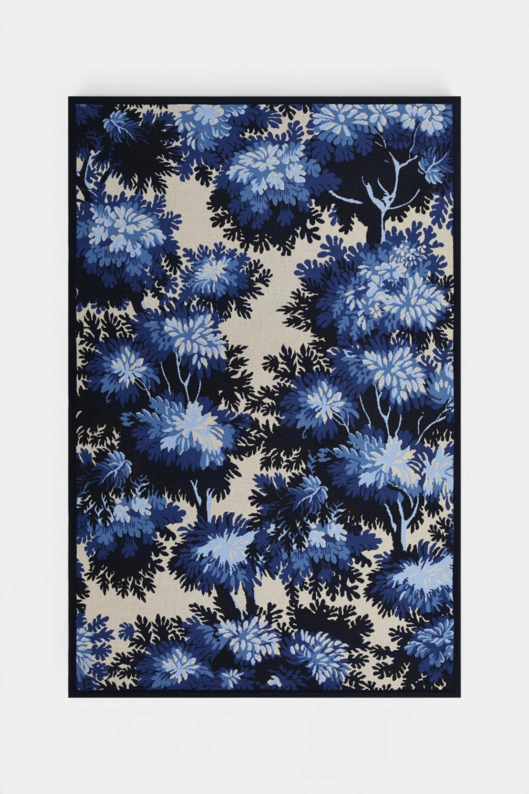 The Copper Shed Inoui Throw 130 featuring a blue and cream floral botanical pattern on soft cotton fabric
