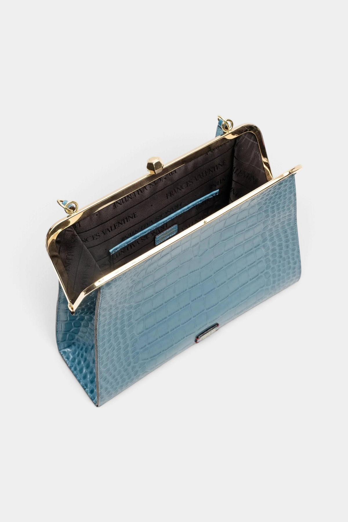 The Copper Shed Jackie Frame bag in blue croc-embossed leather with a vintage gold kiss-lock and jacquard lining.