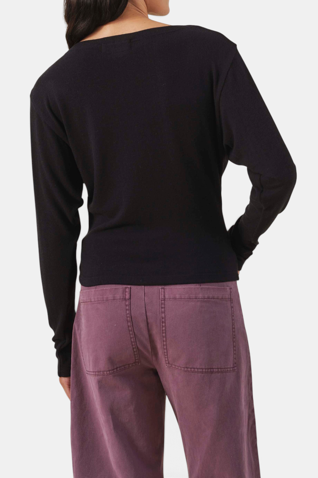 The Copper Shed Jordan black fine-gauge knit cardigan with long sleeves and a fitted, cropped silhouette.