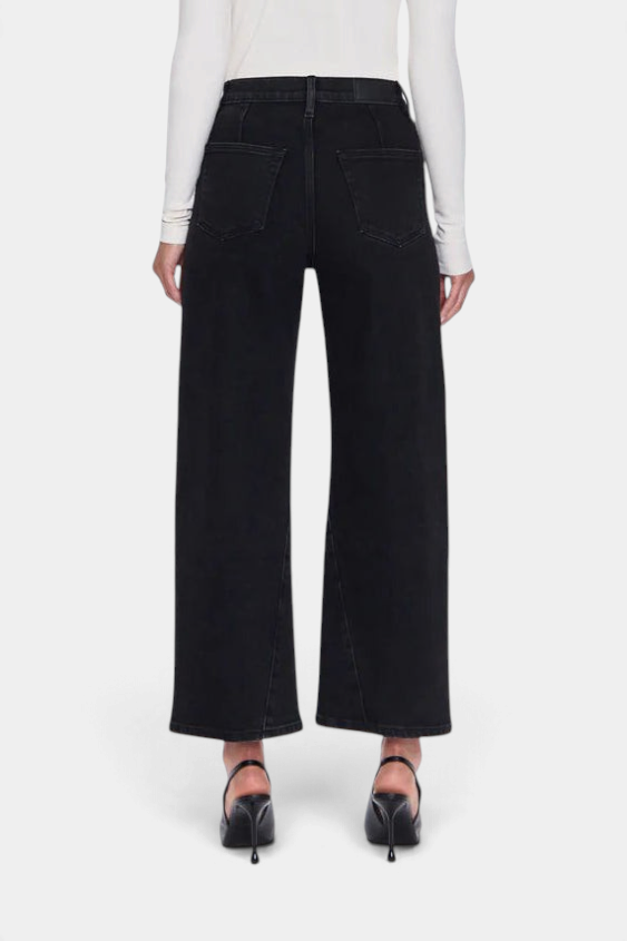 The Copper Shed Kyra high rise bowed ankle jeans in black denim, back view showing yoke seams and wide leg silhouette.