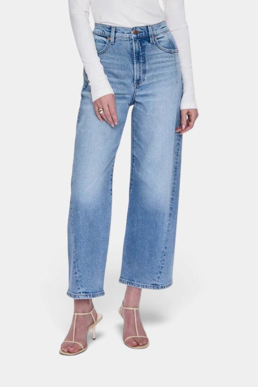 The Copper Shed Kyra high rise bowed ankle jeans in a light vintage wash with a cropped wide leg silhouette
