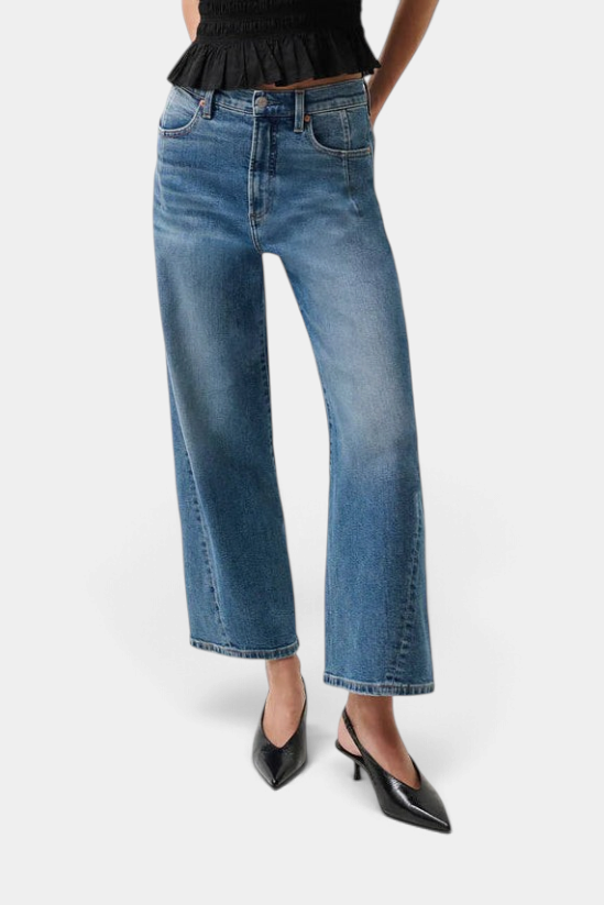 The Copper Shed Kyra high rise bowed ankle jeans in a light vintage wash with twisted seam detailing