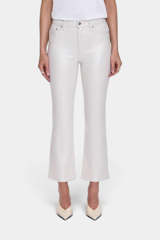 The Copper Shed Lennon high rise boot cut cropped jeans in off-white comfort-stretch denim on a model