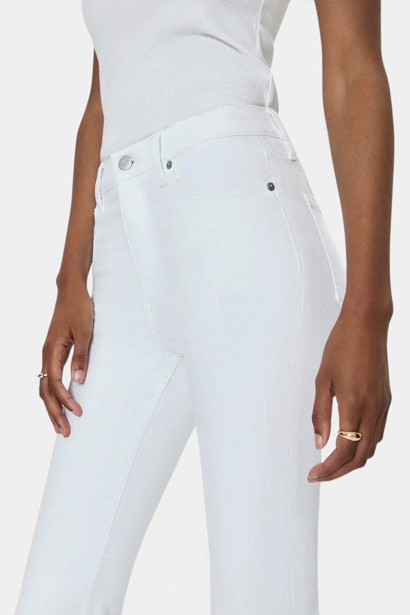 The Copper Shed Lennon high rise white comfort-stretch denim jeans with a boot cut silhouette on a model