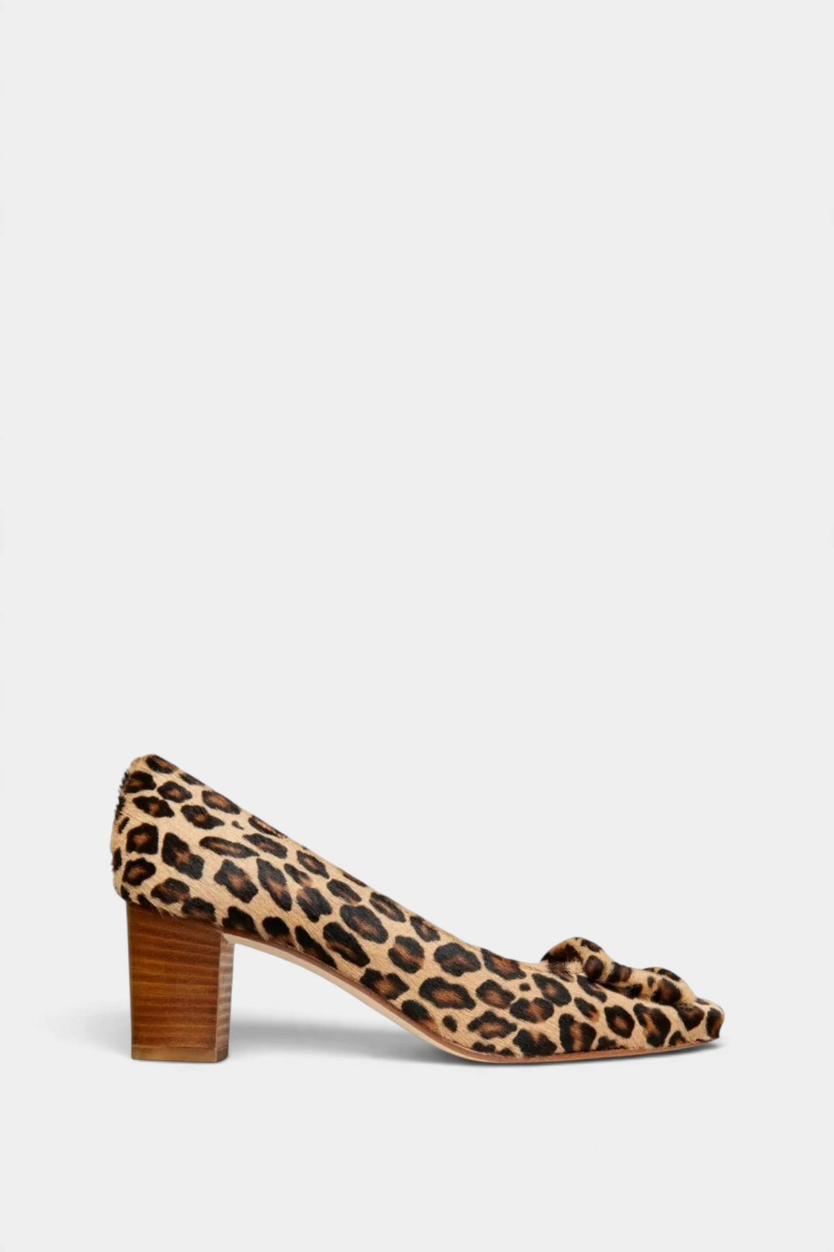 The Copper Shed Buckle Heel in leopard print calf hair with a 2-inch stacked heel and a decorative covered buckle.