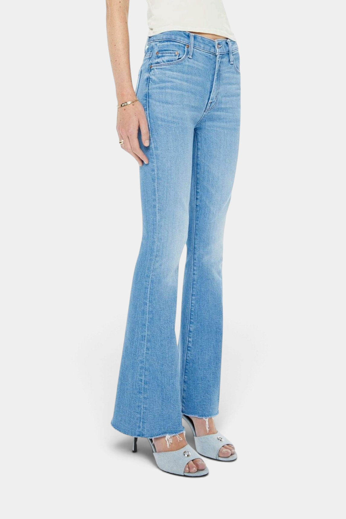 The Copper Shed The Weekender Fray light blue mid-rise flare jeans with a frayed hem and subtle whiskering.