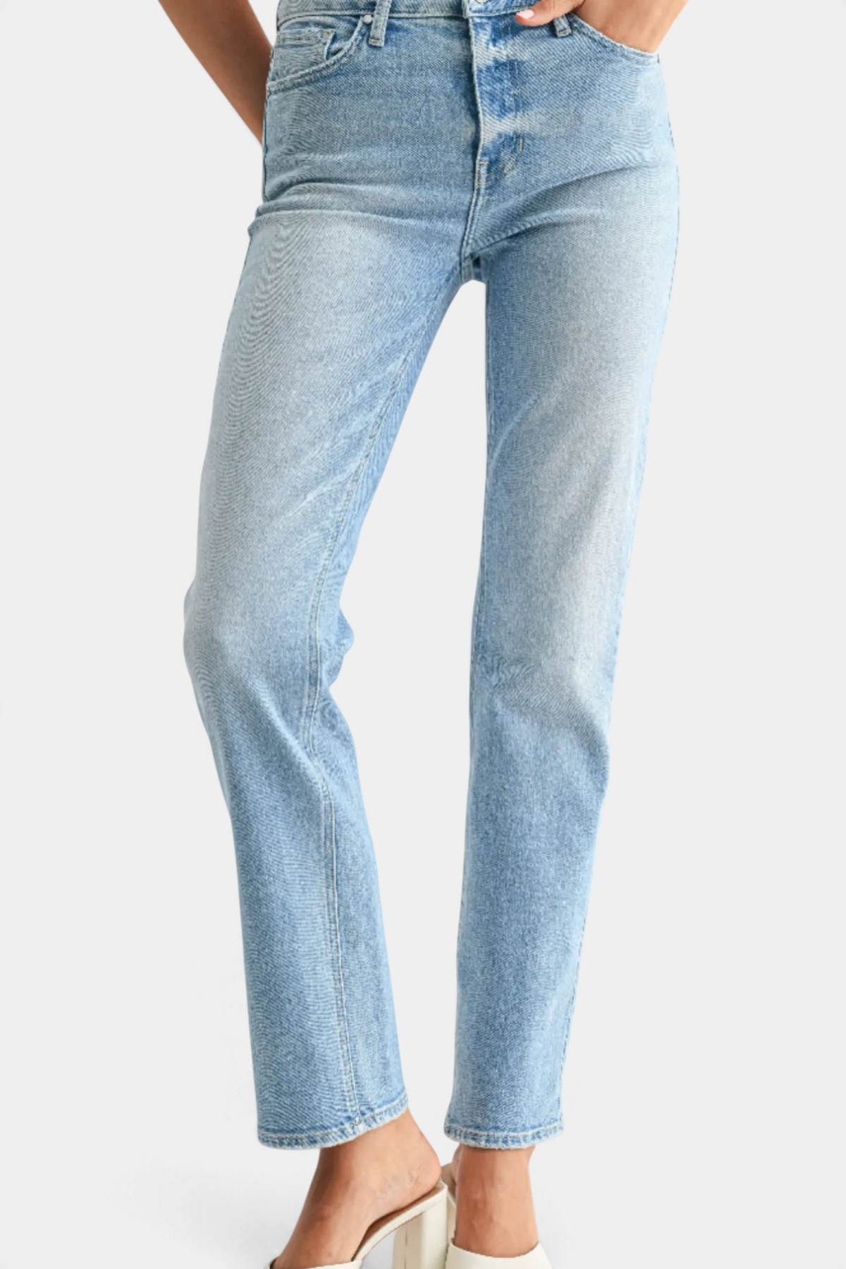 The Copper Shed mid-rise stovepipe straight leg jeans in light wash denim on a model