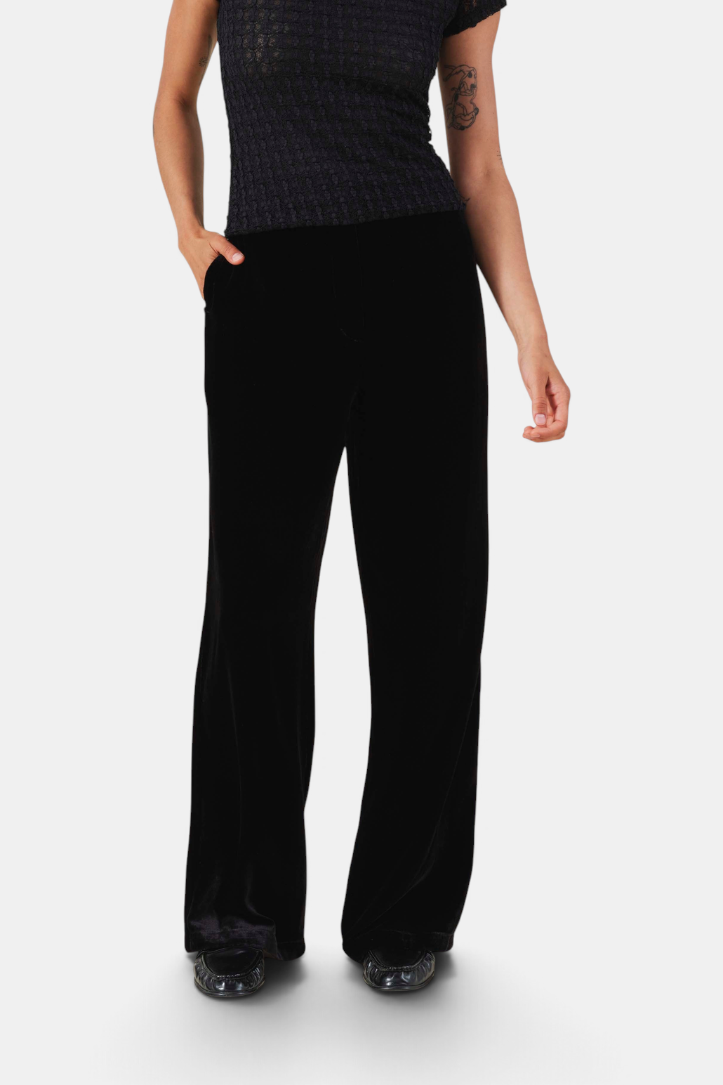 The Copper Shed Lily high-rise flared trousers in black silk-viscose velvet with side pockets.
