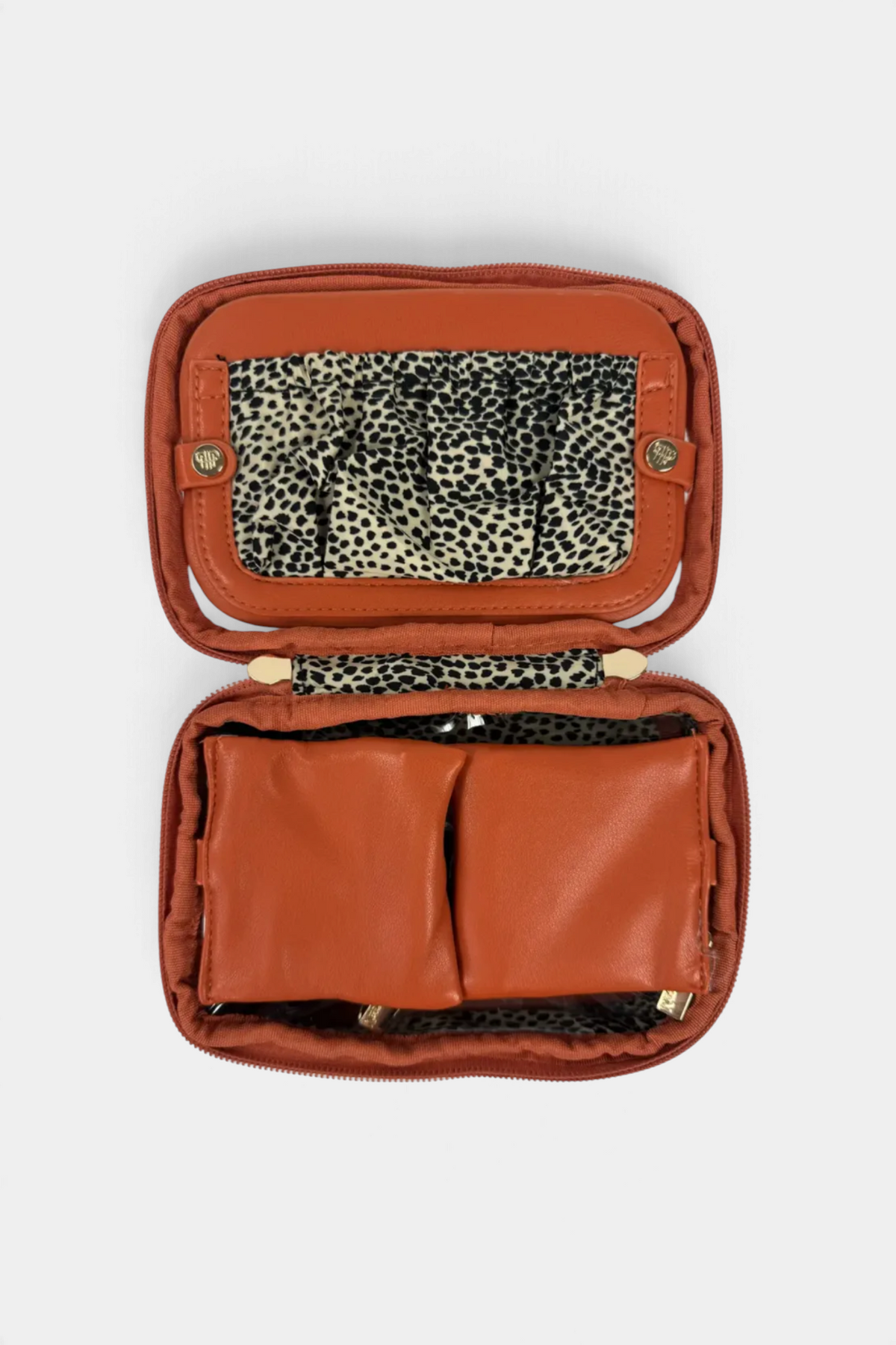 The Copper Shed Littmini lighted mirror case in burnt orange with a leopard print interior and storage compartments.