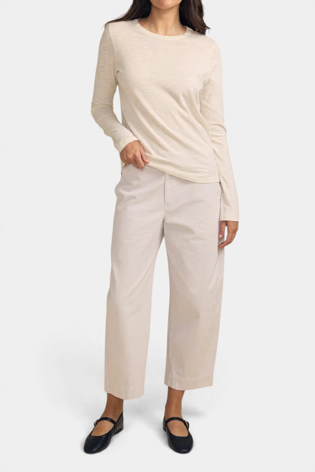 The Copper Shed Lizzie Tee in cream textured cotton slub with long sleeves and a crew neckline worn by a model