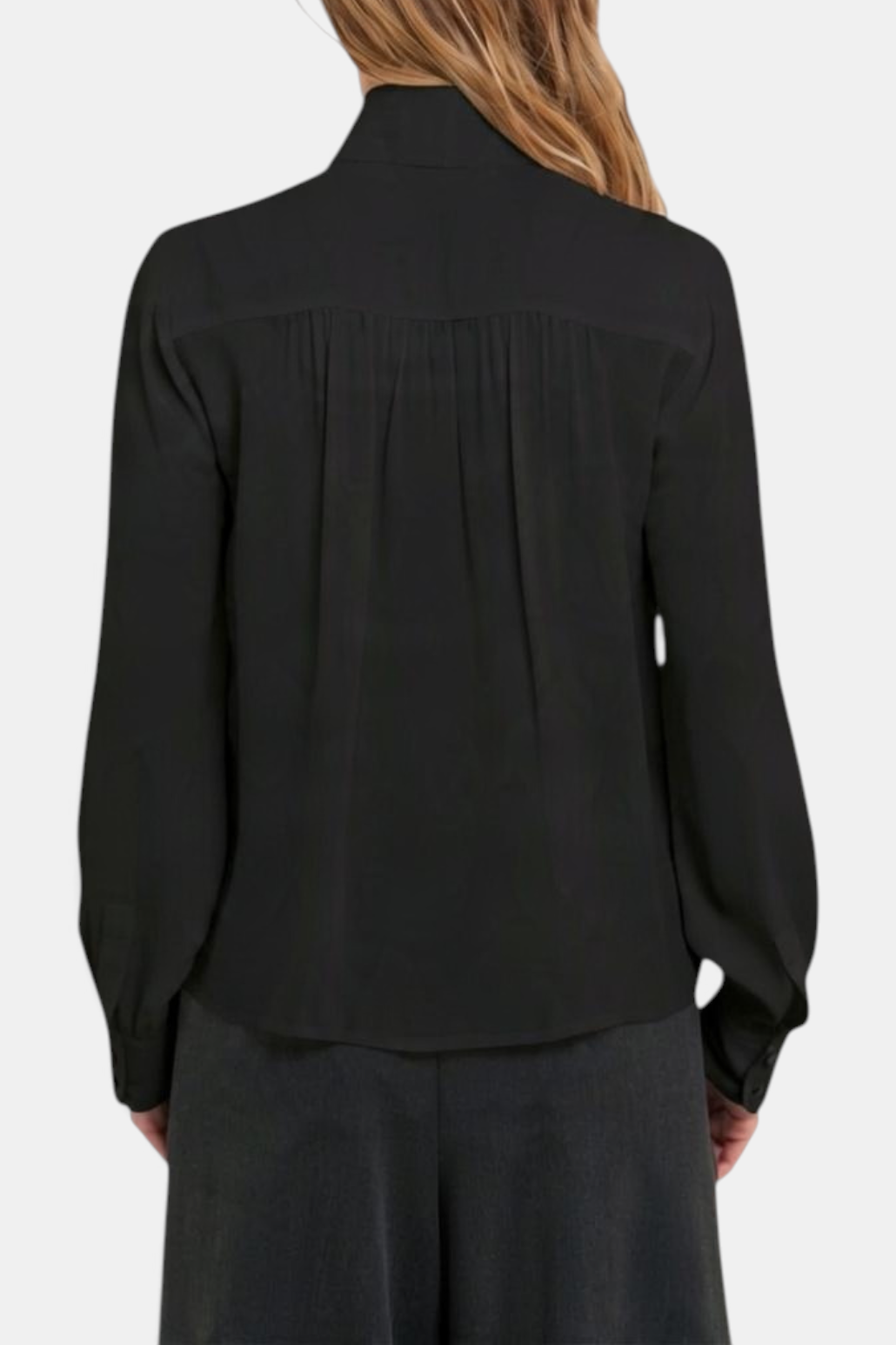 Back view of The Copper Shed Louise black viscose blouse featuring a shirred back yoke and long sleeves.