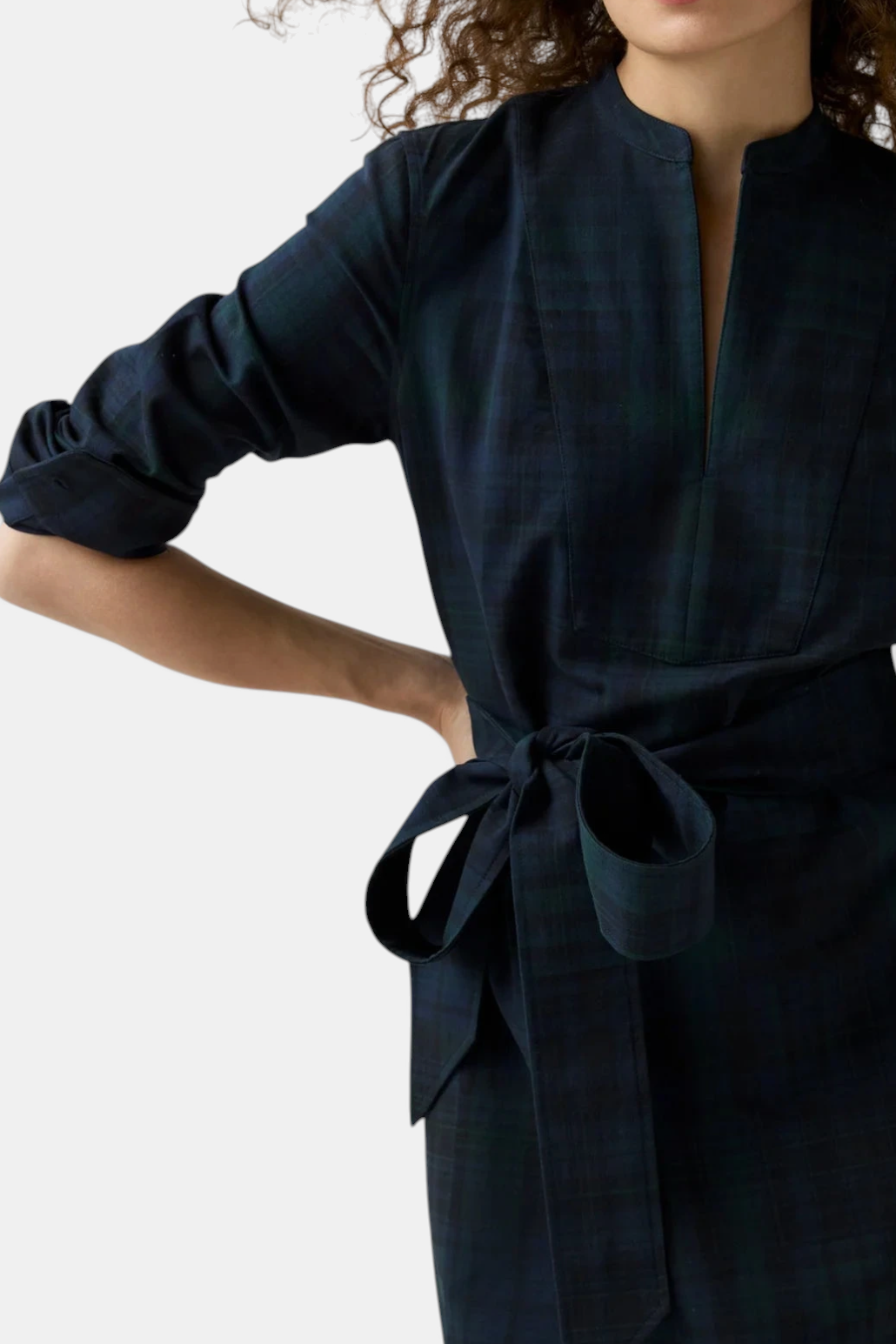 The Copper Shed Mackey dress in navy tartan cotton with a mandarin collar, tuxedo bib, and self-tie waist.