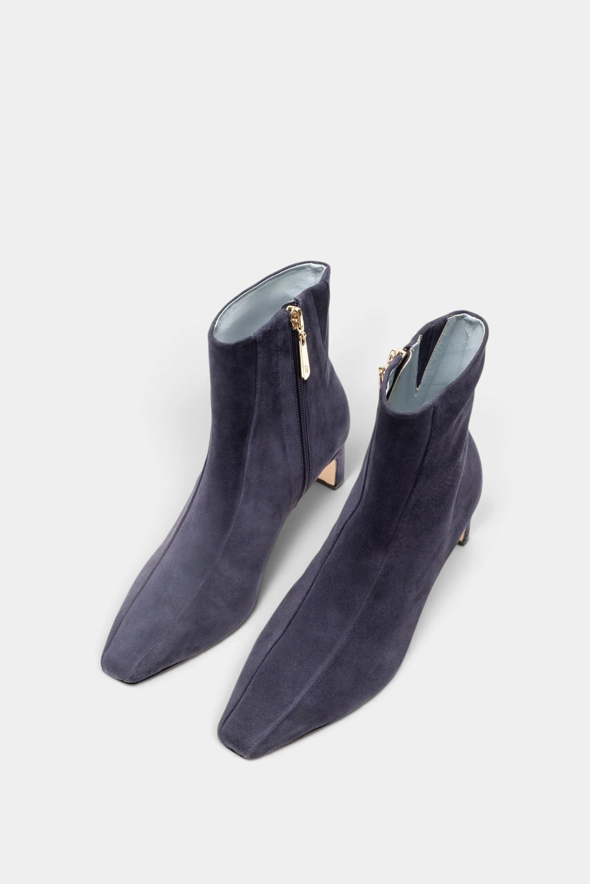 The Copper Shed Marianne navy blue stretch suede ankle boots with a two-inch block heel and polished almond toe.