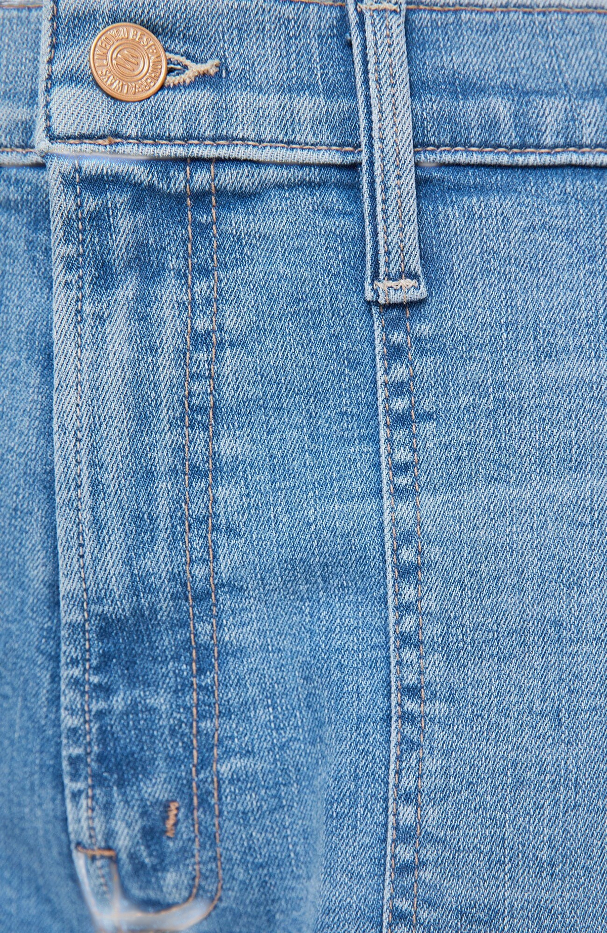 The Copper Shed light blue stretch denim jeans featuring a zip fly, reinforced stitching, and subtle whiskering.
