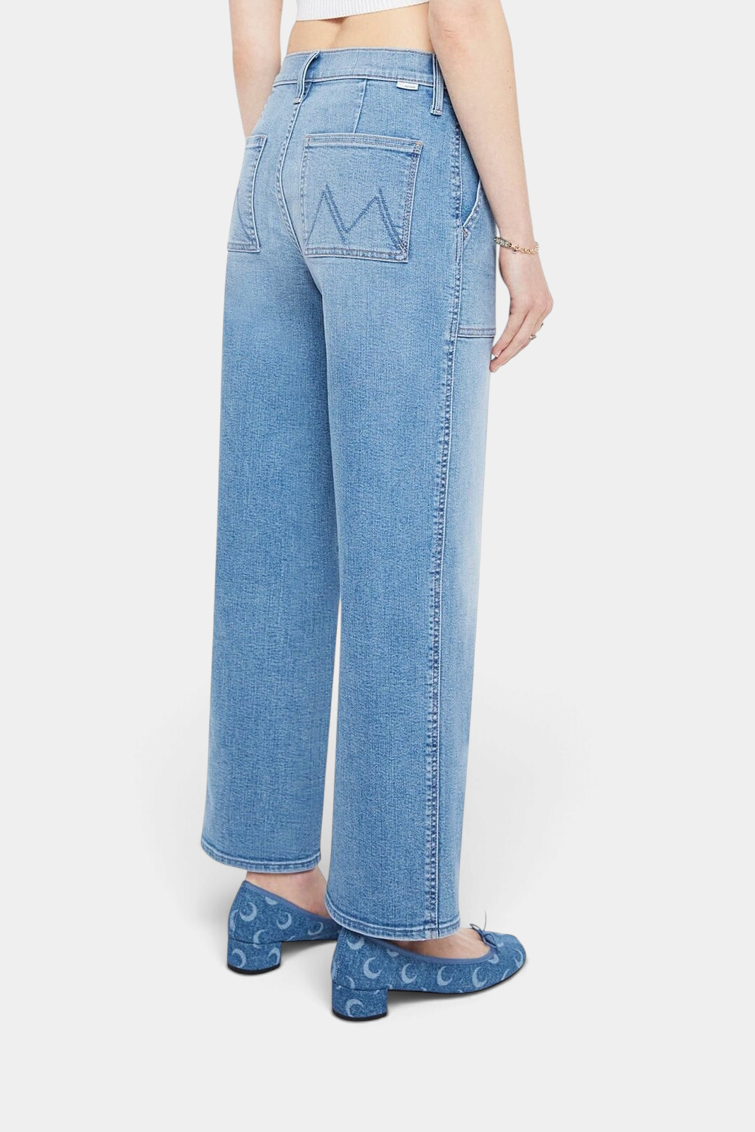 The Copper Shed Maven Flood high-waisted wide-leg jeans in light blue stretch denim with patch pockets, back view.