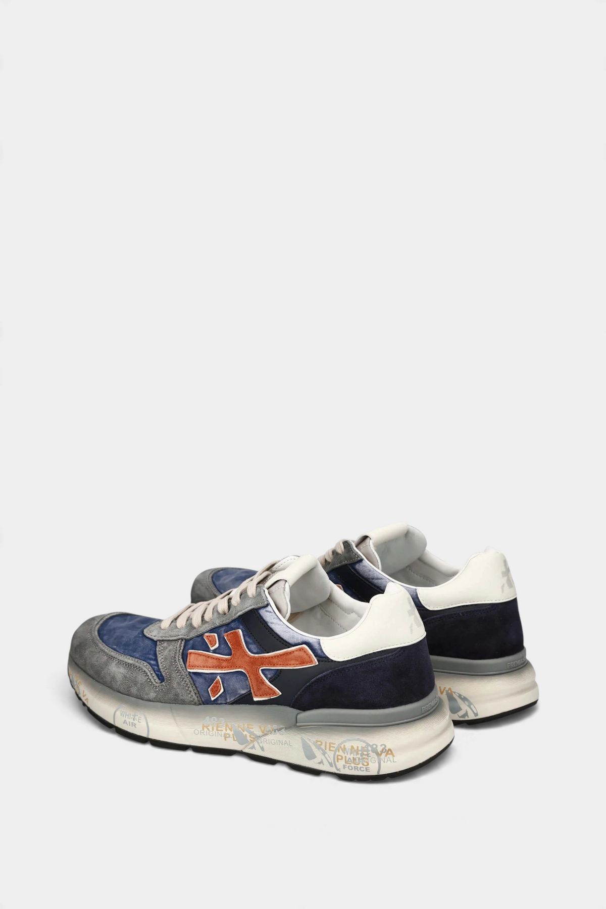 The Copper Shed Mick 7215 sneakers in blue and grey suede with orange logo detail and vintage-effect printed sole.