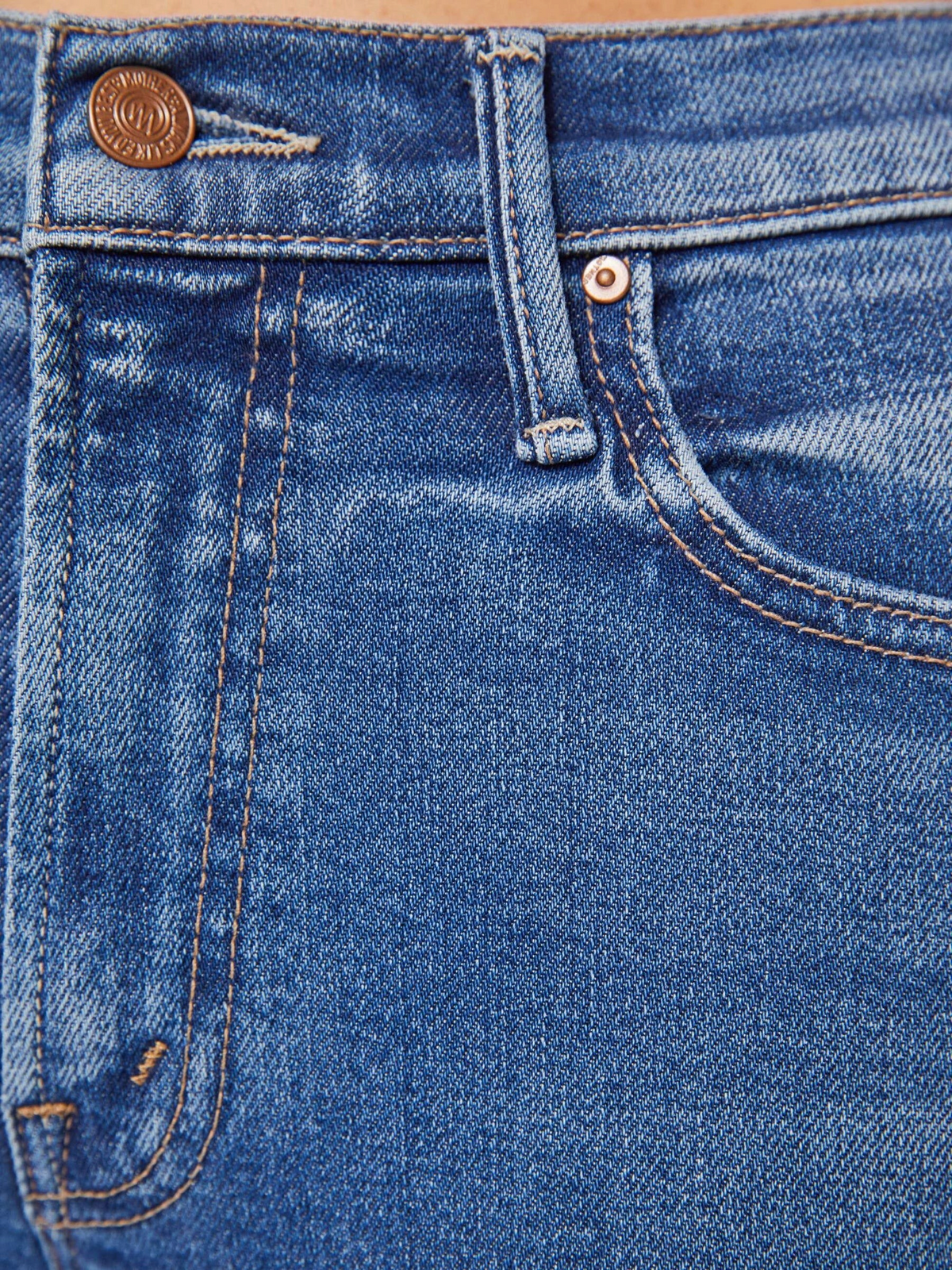 The Copper Shed The Outsider Skimp mid-blue stretch denim jeans featuring contrast stitching and a coin pocket detail.