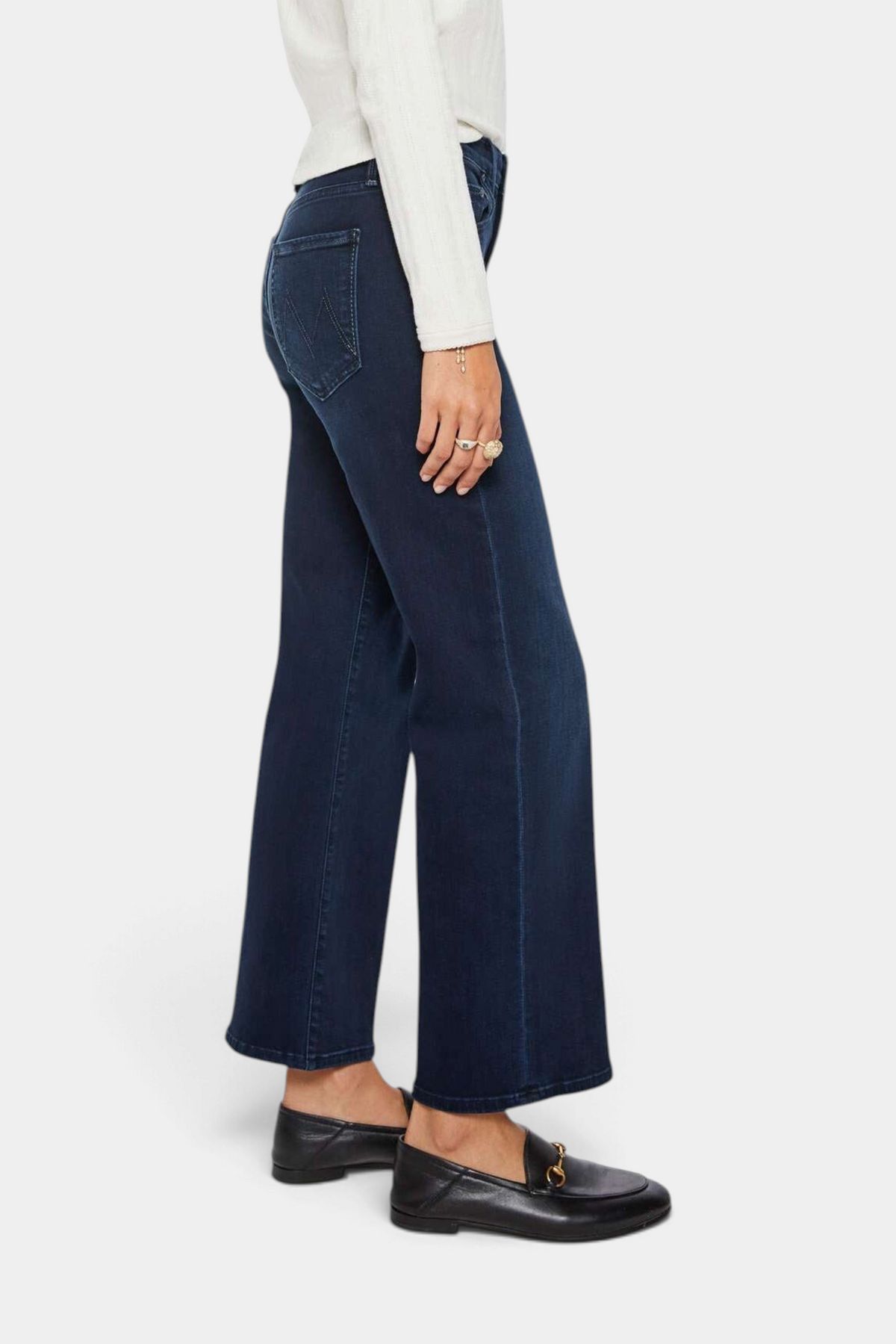 The Copper Shed mid-rise dark blue stretch denim jeans with a wide straight leg and ankle-length cut, side view.