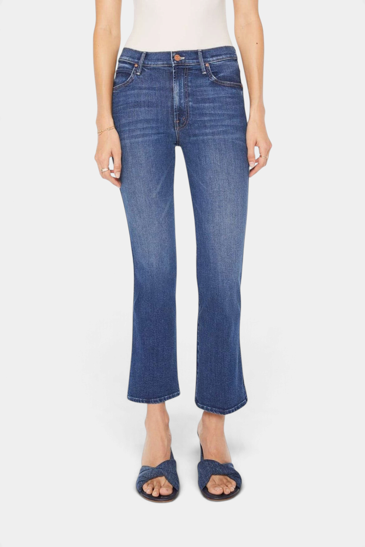 The Copper Shed mid-rise dark blue stretch denim jeans with a flared leg, whiskering, and a clean hem.