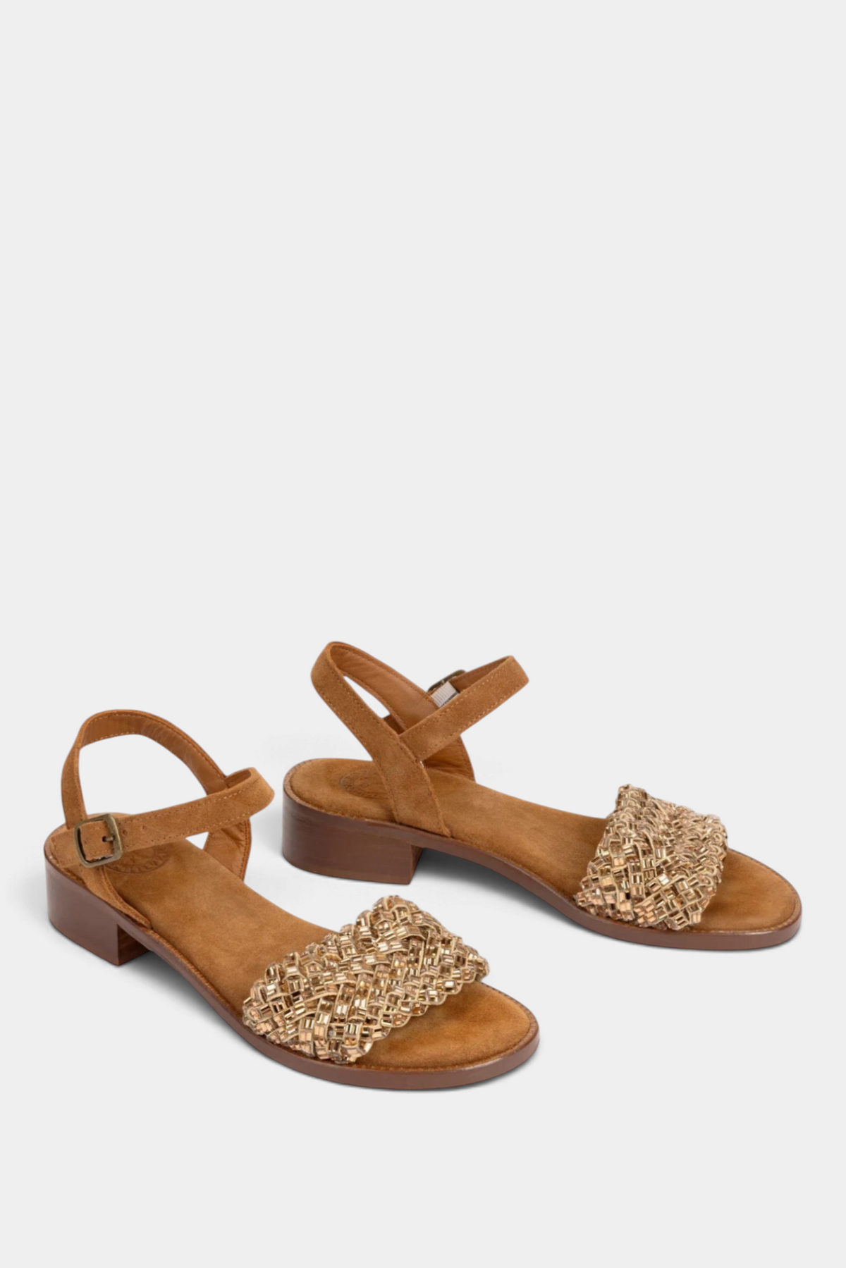 The Copper Shed Milos tan suede sandals featuring a woven diamante strap, ankle buckle, and a low 3cm leather heel.