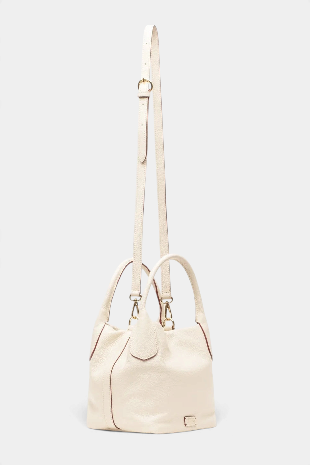 The Copper Shed Mini Sweet Pea cream Italian tumbled leather tote bag with a removable crossbody strap.
