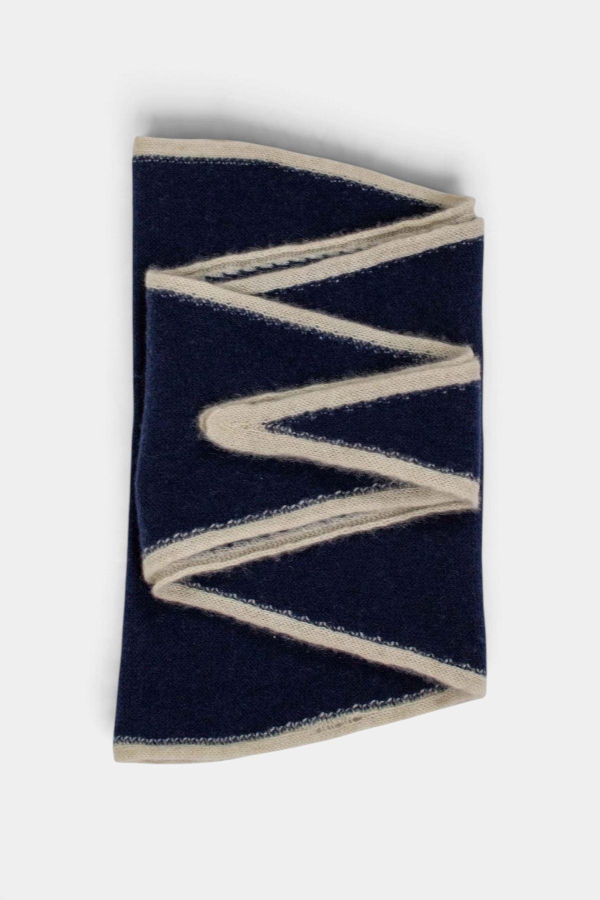 The Copper Shed Austen spindle-shaped navy blue and cream organic cashmere scarf with a lightweight knitted design.