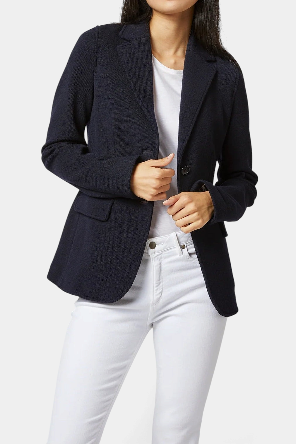 The Copper Shed navy blue unlined wool pique blazer with flap pockets worn over a white t-shirt and jeans